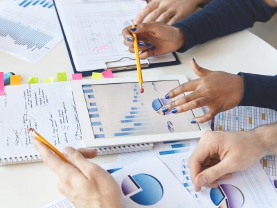 colleagues-working-together-financial-report-using-modern-gadget colleagues-working-together-financial-report-using-modern-gadget